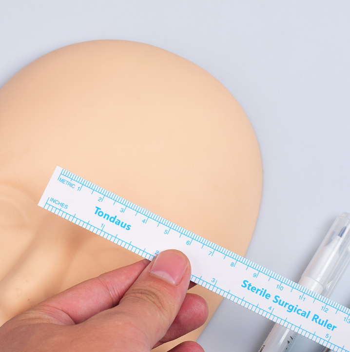 Marqueur chirurgical stérile avec règle